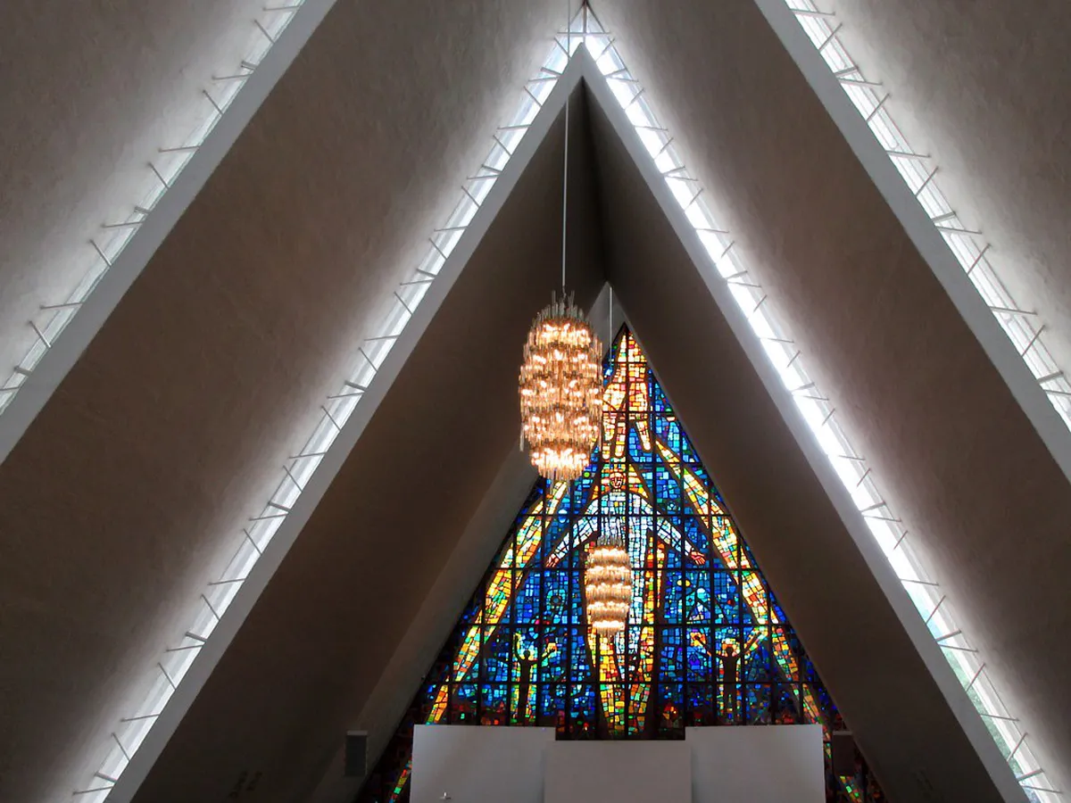 Monumental glass mosaic at Arctic Cathedral in Tromsø depicting the second coming of Christ with thick colored glass pieces creating a luminous effect