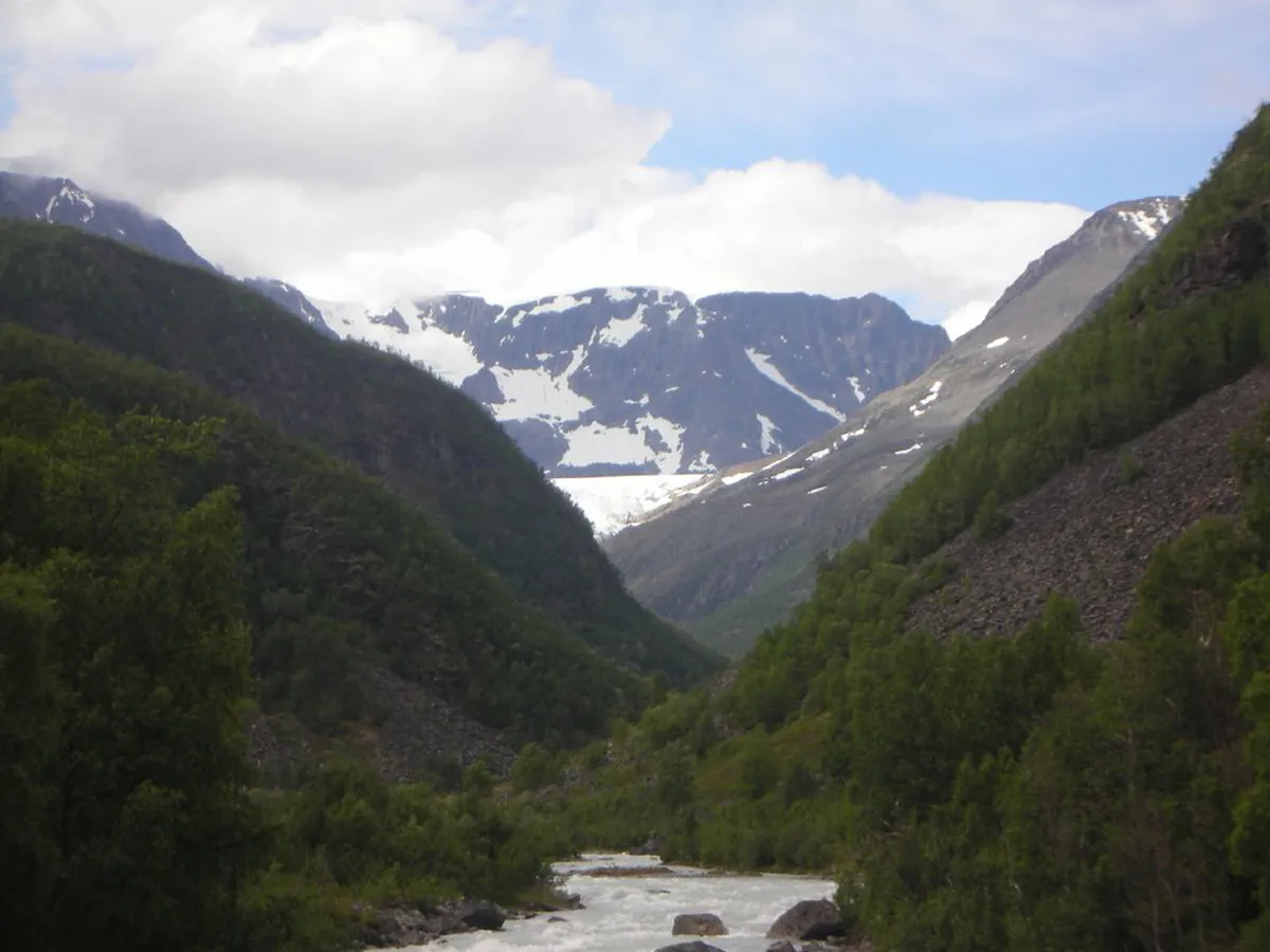 Dramatic snow-capped peaks of the Lyngen Alps rising above Svensby, Tromsø, Norway on the Lyngen Peninsula