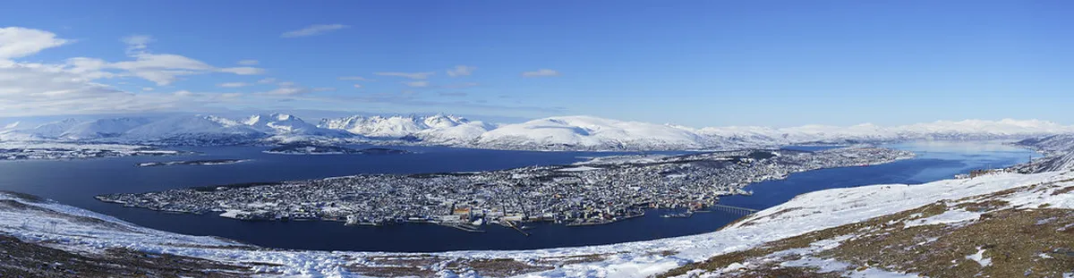 Dramatic Arctic fjord landscape with mountain terrain surrounding Tromsø, Norway
